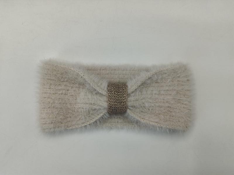 Beige fuzzy knit ear warmer headband with gold metallic crochet center band, flat lay on white background