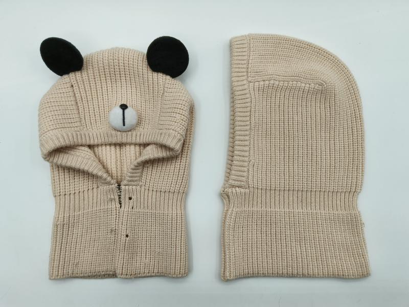 Beige chunky knit bear balaclava with black ears and embroidered nose, shown front and back view on white background
