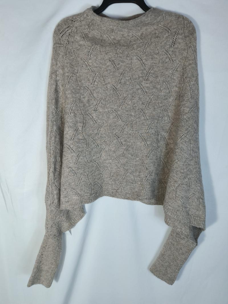 Beige cropped knit sweater with diamond pointelle pattern and long sleeves displayed on hanger
