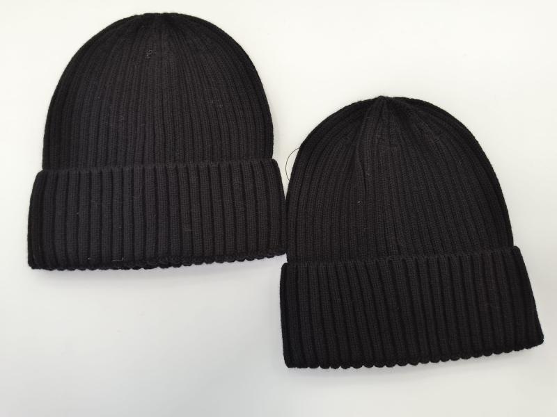 Two black ribbed knit beanie hats with cuffed brims displayed flat on white background, one larger and one smaller