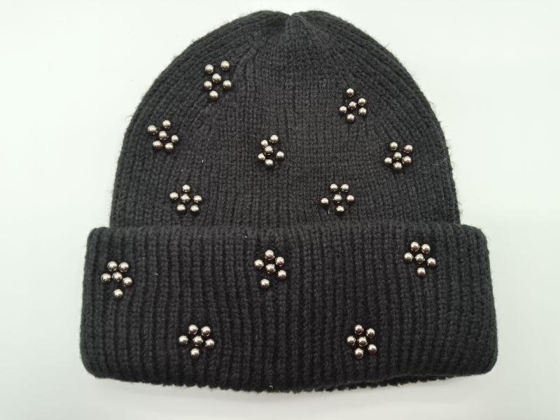 Black ribbed knit winter beanie hat adorned with scattered silver metallic bead flower clusters on folded cuff style