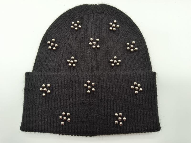 Black ribbed knit beanie hat with silver metal ball stud floral clusters scattered across the cuff and crown