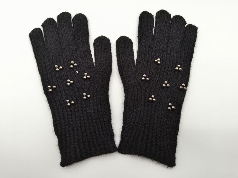 Pair of black ribbed knit winter gloves adorned with small silver metallic stud clusters on the back of the hand
