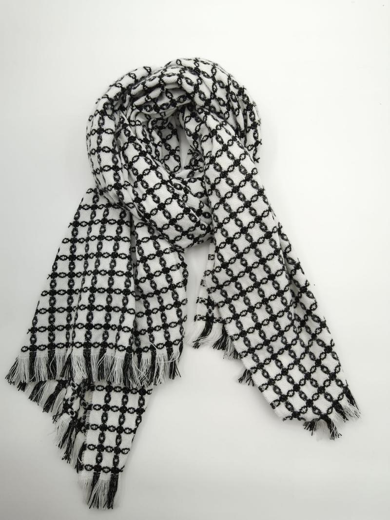 Black and white chain-link pattern woven scarf with fringe tassel ends, loosely draped on white background