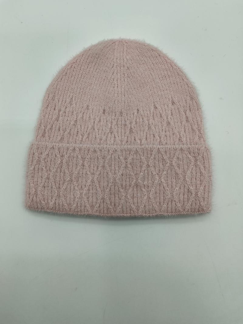 Blush pink fluffy cable knit beanie hat with diamond pattern and folded cuff on light background