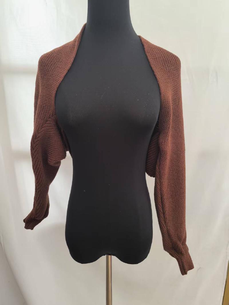 Brown chunky knit cropped bolero shrug cardigan with long sleeves displayed on a black mannequin against white background