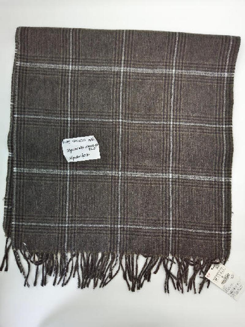 Flat lay of a brown and white glen plaid woven scarf with twisted fringe trim, polyester viscose blend