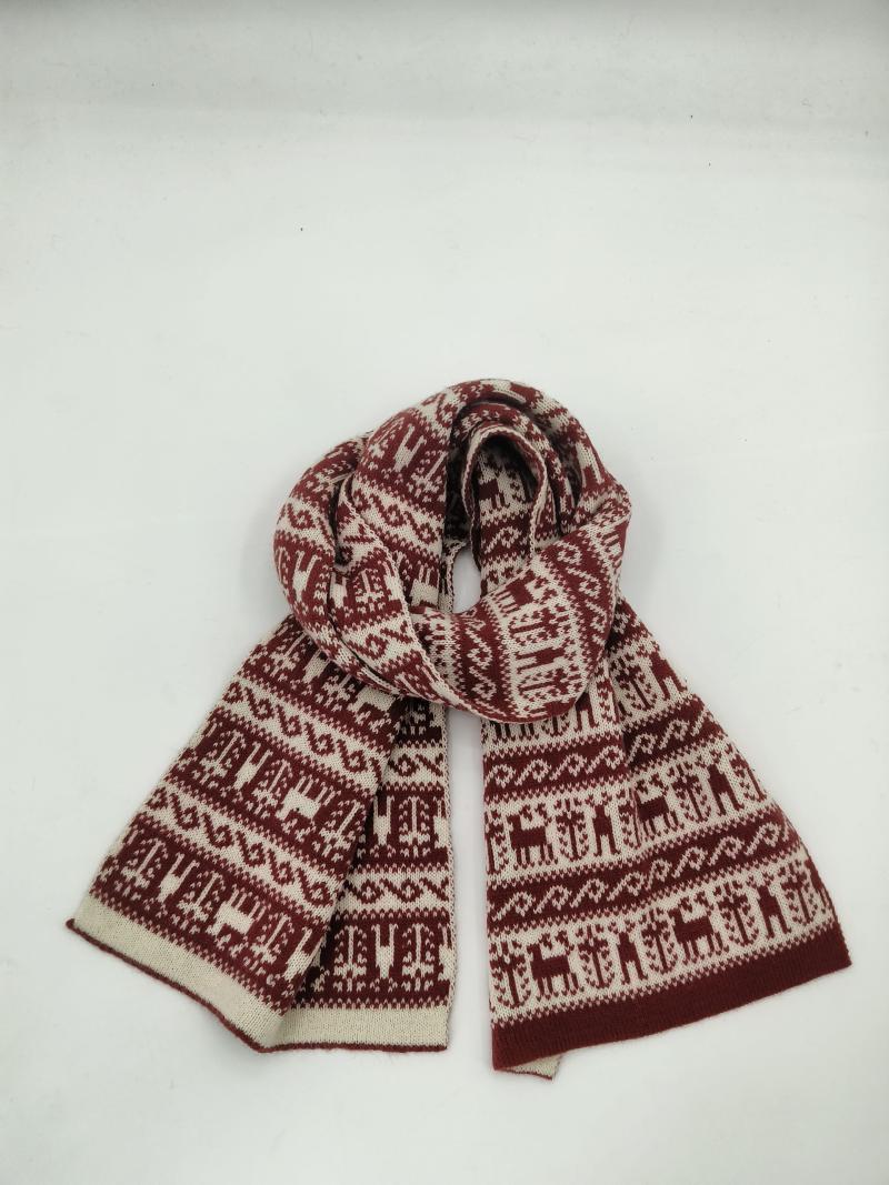 Knitted winter scarf in burgundy and cream with Fair Isle reindeer and Nordic pattern, looped on white background