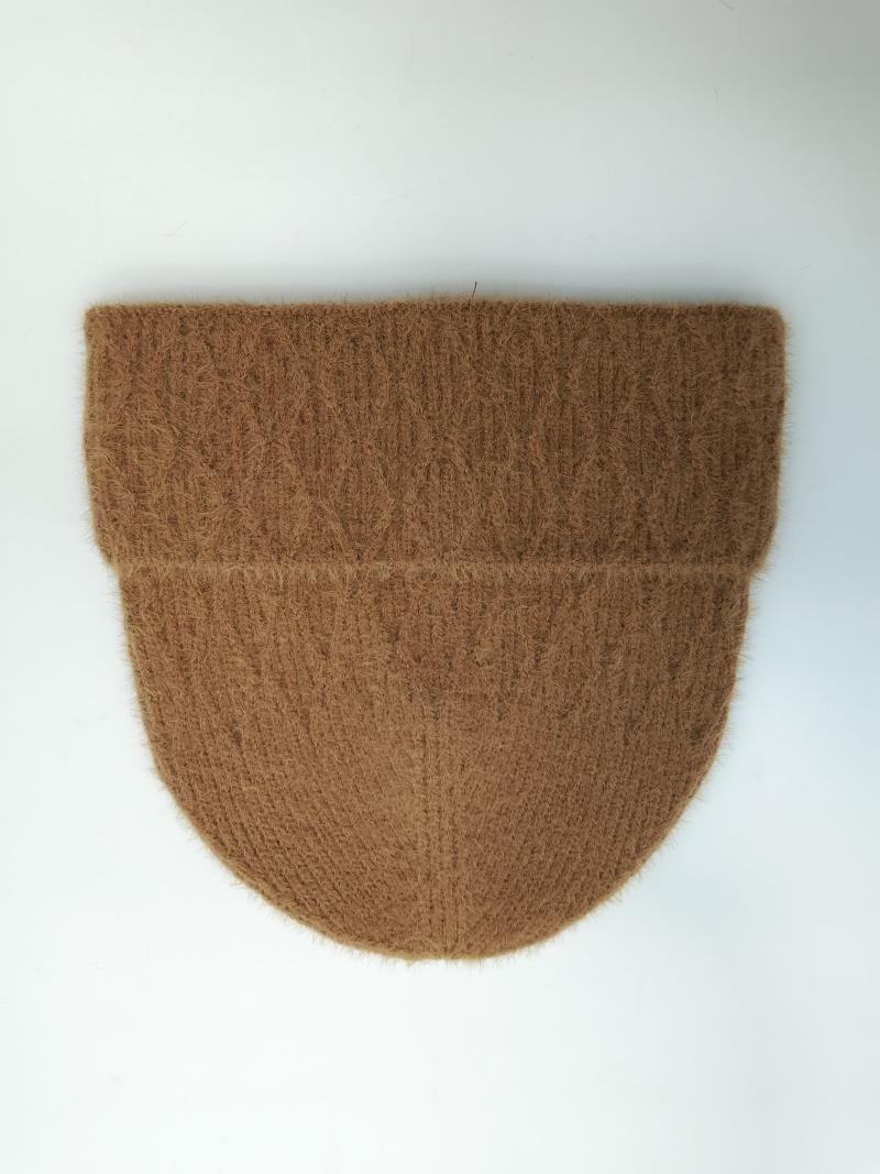 Flat lay of a camel brown fuzzy ribbed knit beanie hat with folded cuff on white background