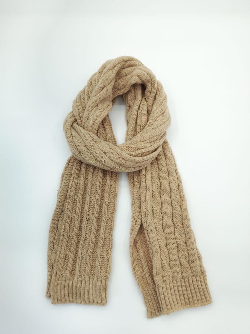 Camel beige cable knit scarf looped and laid flat on white background showing ribbed texture and twisted pattern