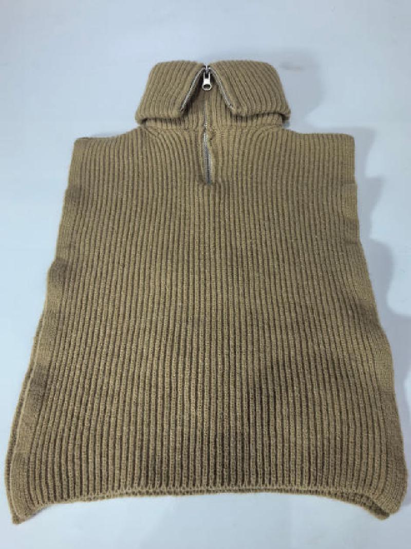Camel beige ribbed knit sleeveless poncho sweater vest with silver half-zip turtleneck collar, laid flat on white background
