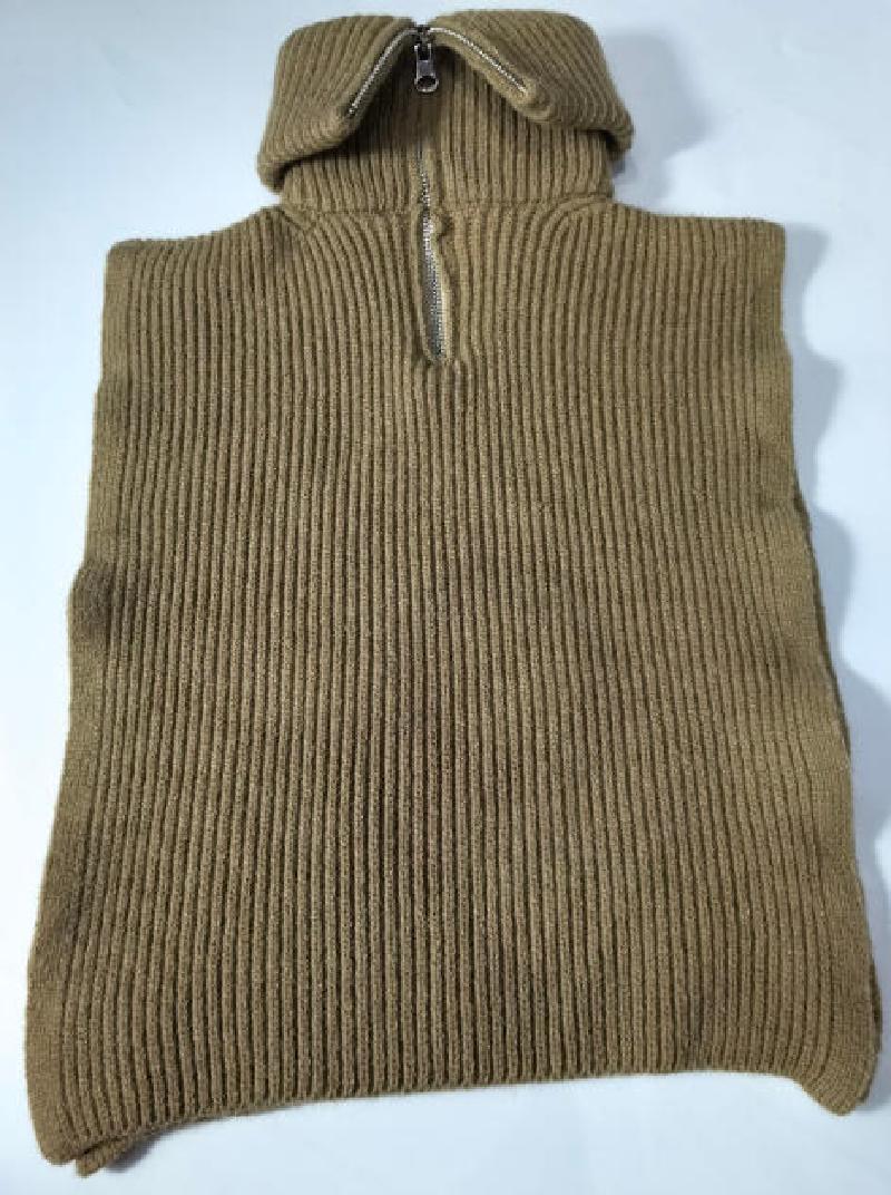 Camel tan ribbed knit sleeveless poncho vest with half-zip collar, laid flat on white background