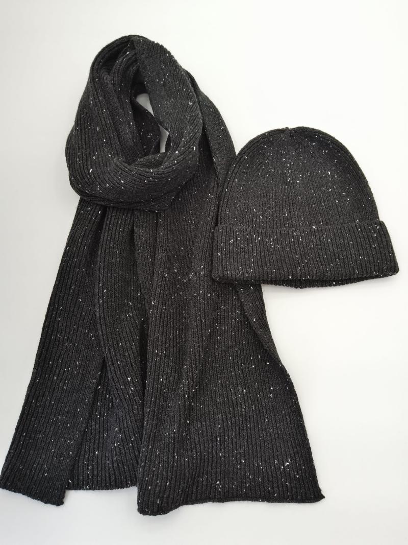 Dark charcoal ribbed knit scarf and matching beanie hat with white fleck speckle pattern on white background