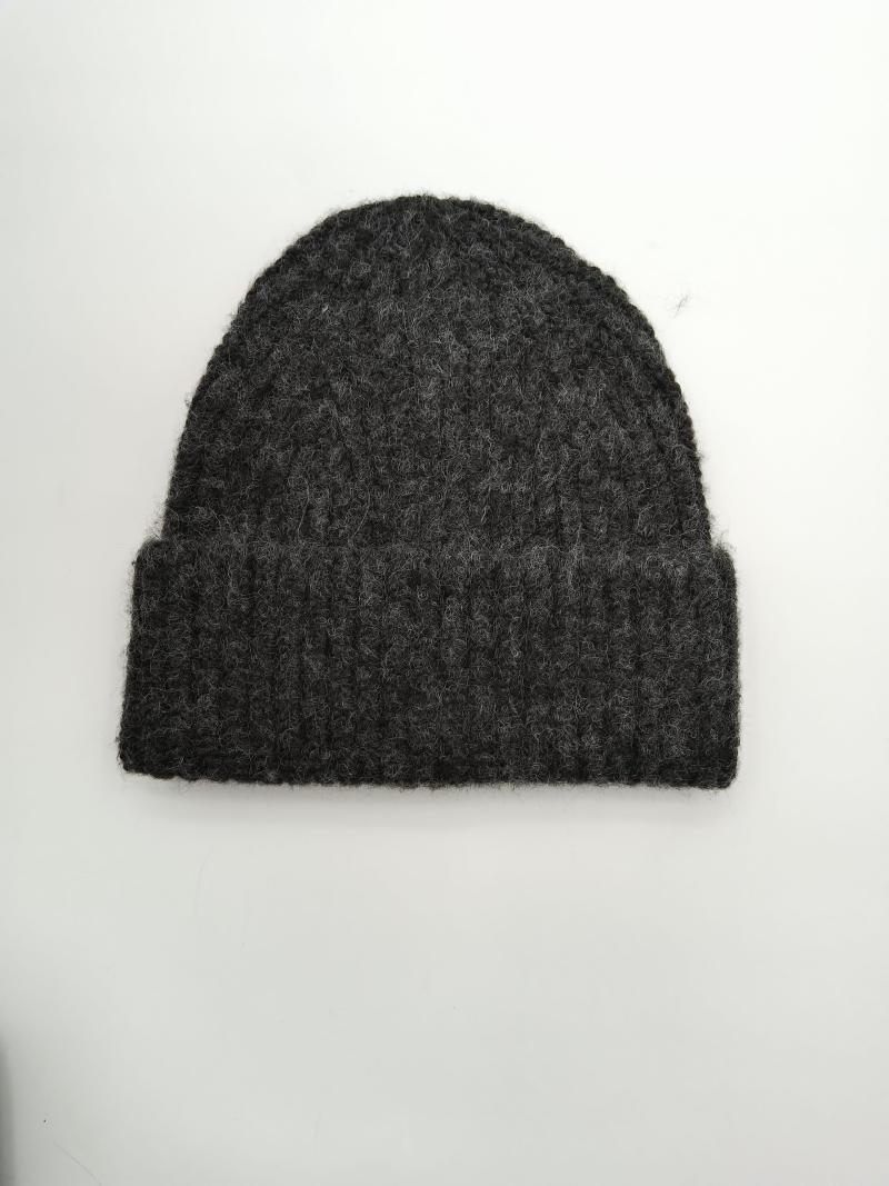 Dark charcoal grey chunky ribbed knit beanie hat with folded cuff, flat lay on white background