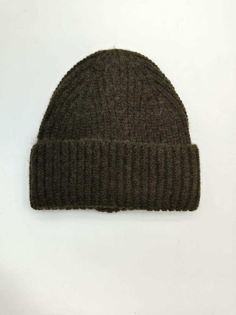 Olive green chunky ribbed knit beanie hat with folded cuff, laid flat on white background