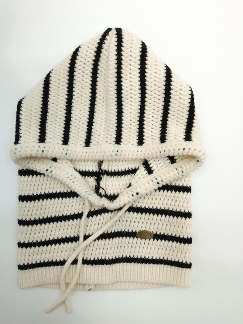 Folded cream and black striped crochet knit hoodie sweater with drawstring hood and ribbed hem, displayed flat on white background