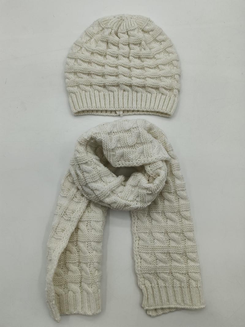Cream cable knit winter hat and matching long scarf set laid flat on white background