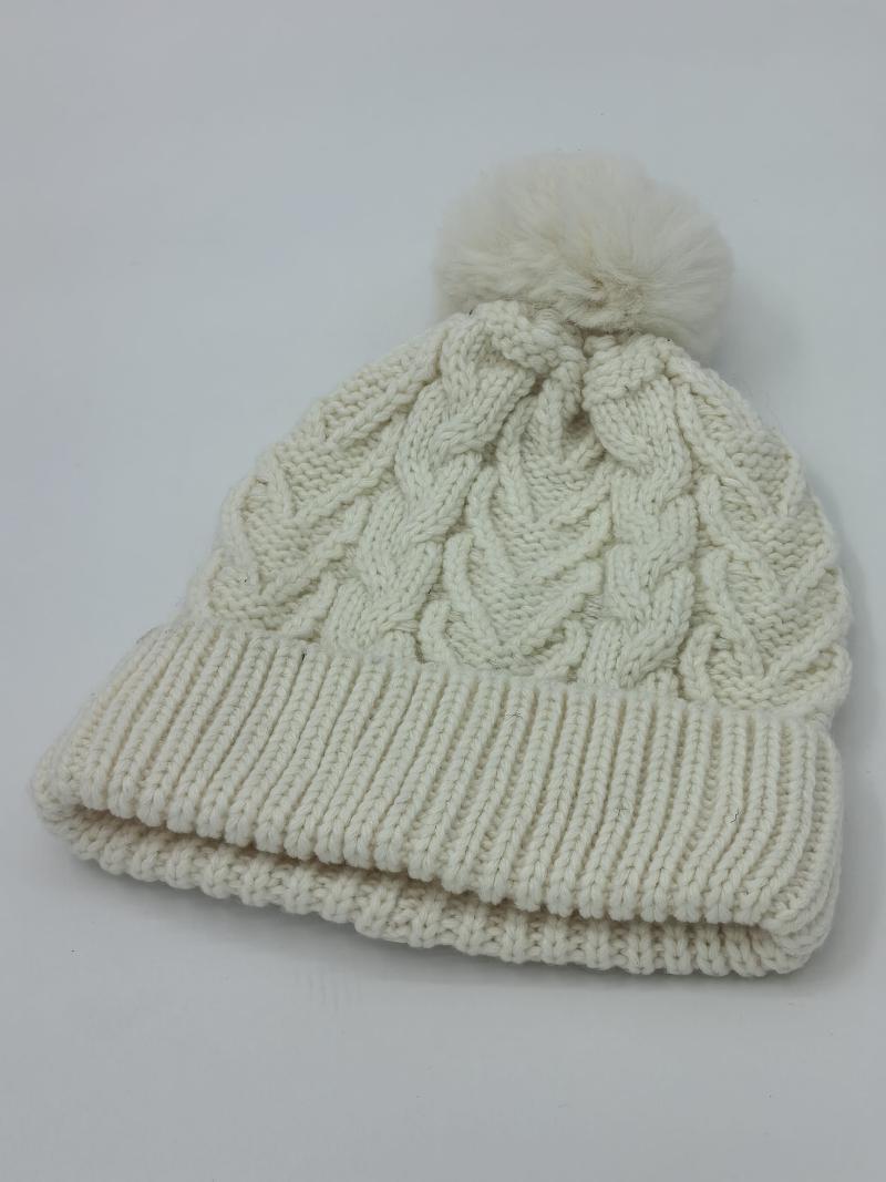 Cream white cable knit winter beanie hat with fluffy pom pom on top and double ribbed fold-up cuff