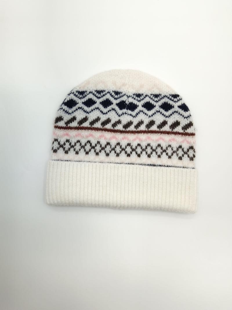 Cream knit beanie hat with Fair Isle pattern in navy, brown, and pink stripes on white background