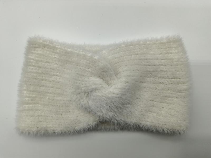 Cream white fuzzy ribbed knit headband with center twist knot detail, laid flat on white background
