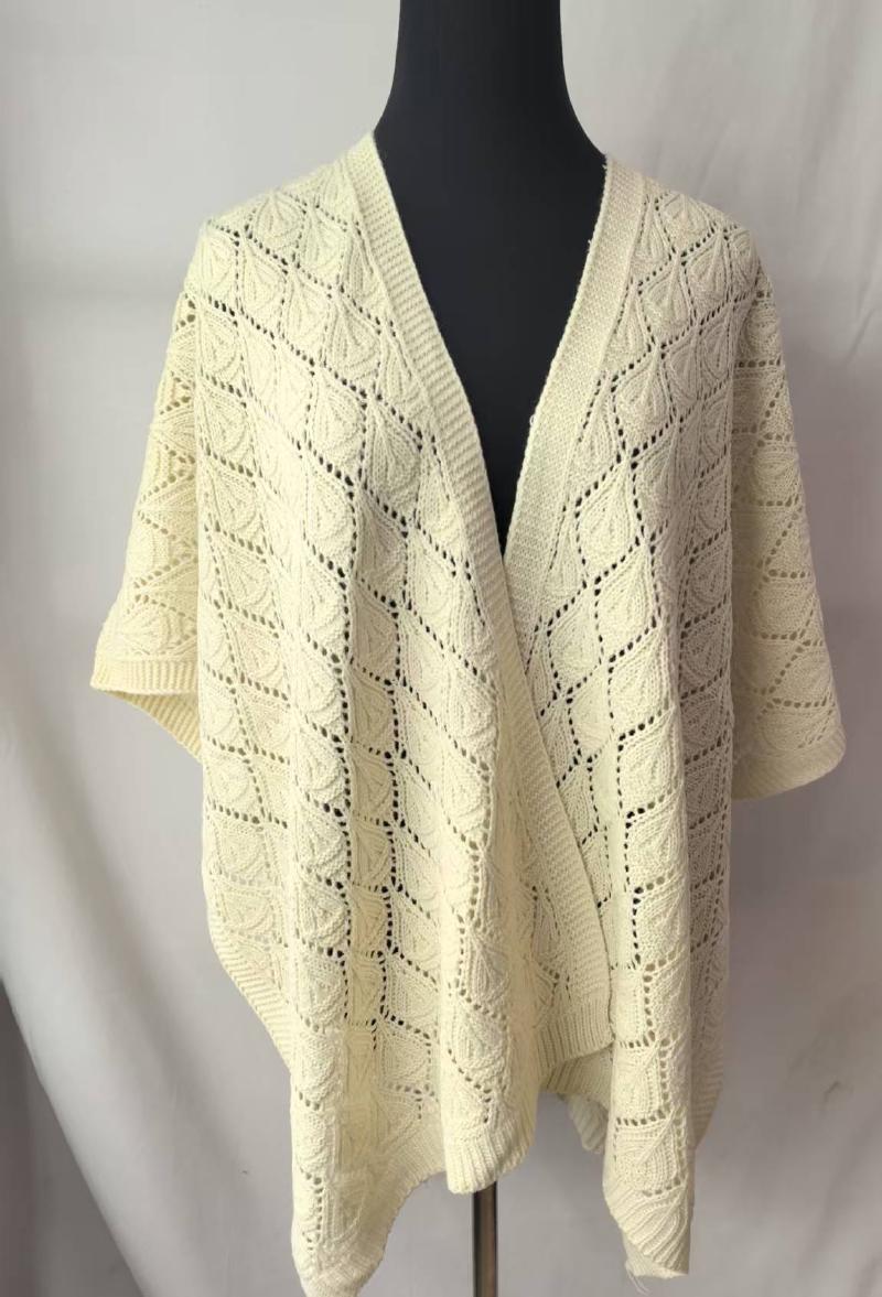 Cream ivory open-knit lace poncho wrap cardigan with diamond leaf pattern displayed on black mannequin