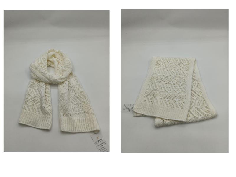 Cream white chunky open-knit scarf with geometric pointelle pattern shown draped and folded on white background