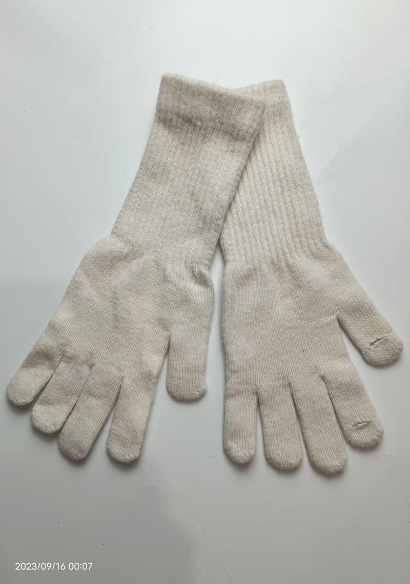 Pair of cream off-white ribbed knit full-finger gloves laid flat on white background, showing both palms