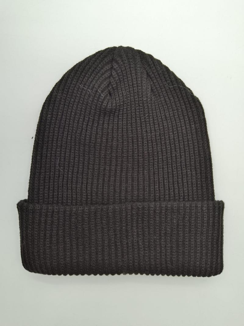 Dark charcoal ribbed knit beanie hat with folded cuff brim, laid flat on white background
