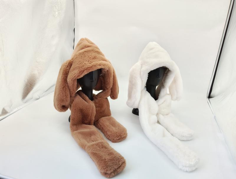 Two fluffy faux fur hooded scarf hat sets with long bunny ears in brown and white displayed on mannequin heads