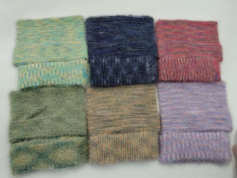Six square fabric swatches with soft fluffy brushed texture in teal, navy, red-pink, sage green, tan, and lavender multicolor
