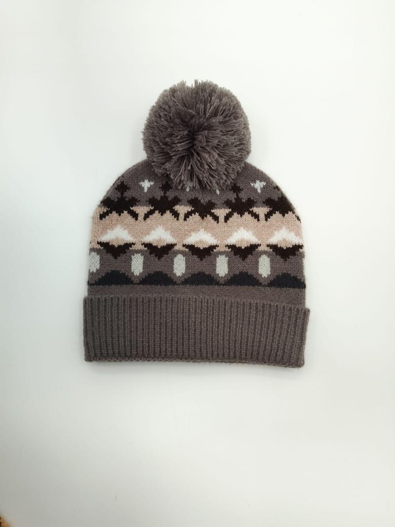 Gray knit winter beanie hat with Fair Isle Nordic pattern in pink, brown, and white, featuring a fluffy gray pom-pom on top