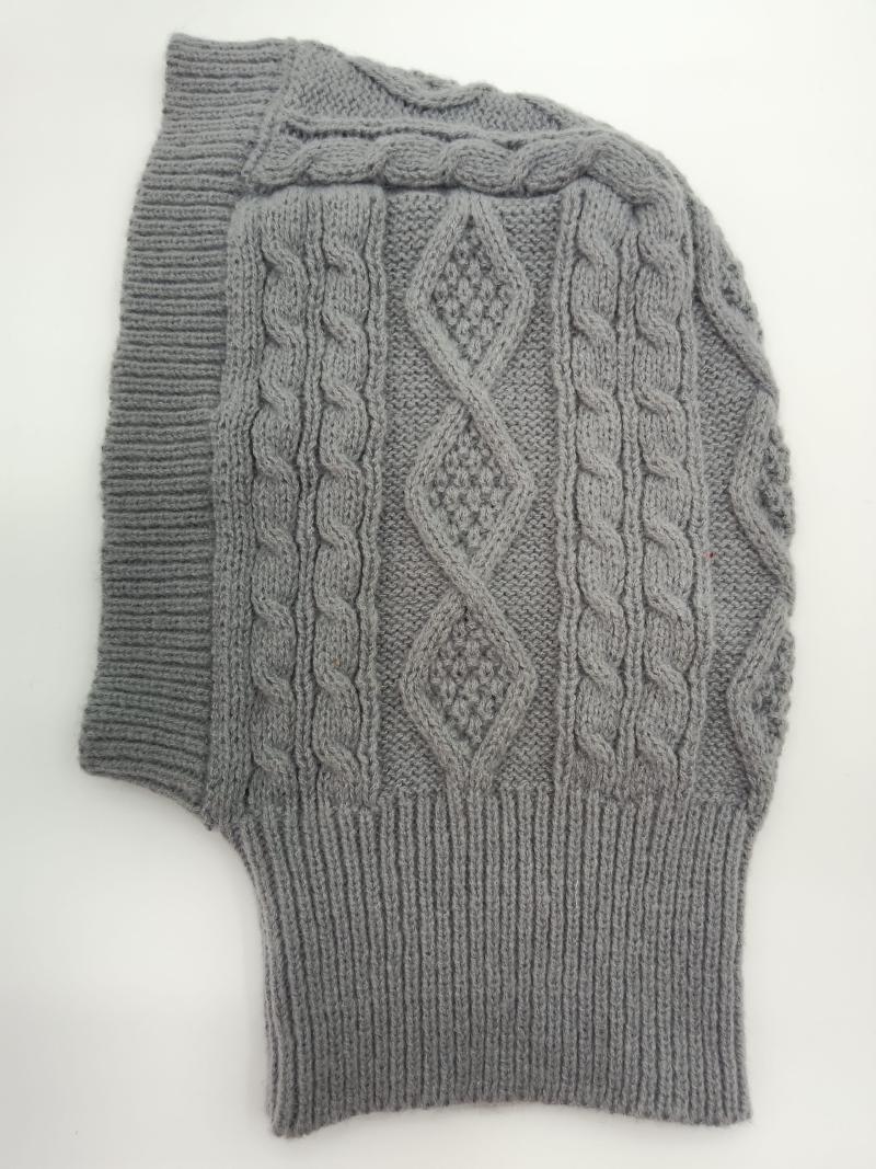 Grey cable knit balaclava laid flat showing diamond and twisted cable stitch pattern with ribbed edges