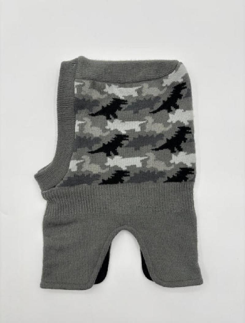 Grey knit balaclava laid flat showing black white grey camouflage jacquard pattern on front panel with ribbed edges