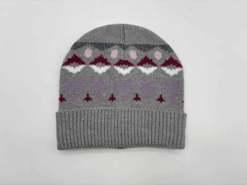 Grey knitted beanie hat with Fair Isle pattern featuring burgundy, white, pink and lavender geometric motifs and ribbed cuff