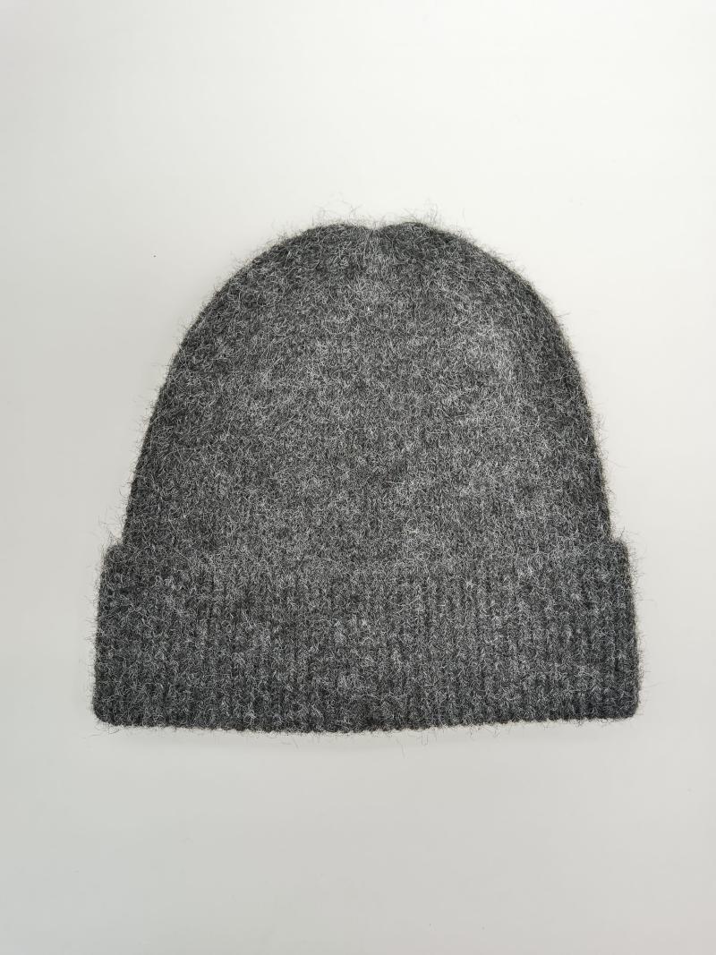 Grey fluffy knit beanie hat with ribbed cuff, laid flat on white background, soft wool blend winter hat
