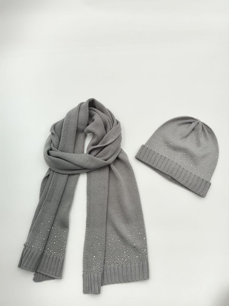 Grey knitted beanie hat and long scarf set with scattered rhinestone crystal details on white background