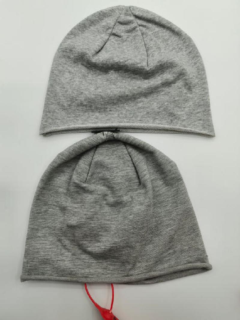 Two grey marl jersey knit slouchy beanie hats laid flat on white background, showing front and back views