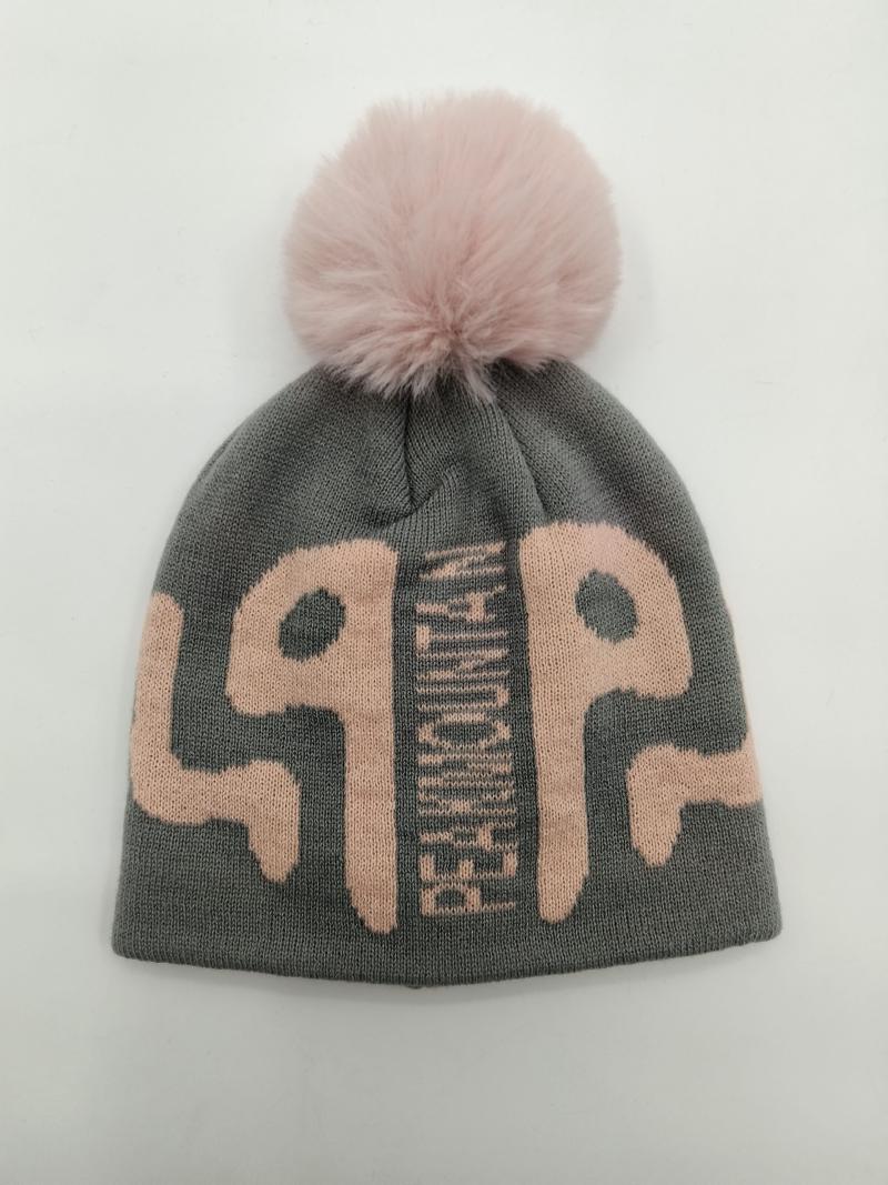 Grey knit winter beanie hat with large pink graphic letters and fluffy pink faux fur pom pom on top