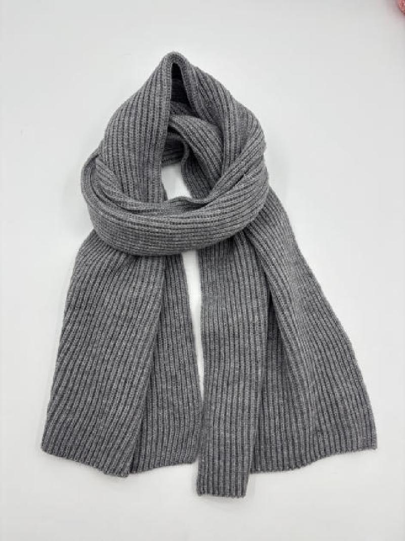 Grey ribbed knit scarf loosely knotted on white background, showing fine rib texture and soft wool-blend fabric