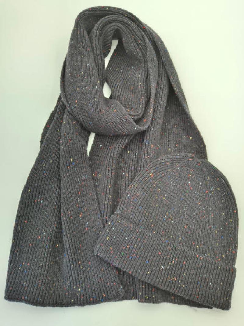 Grey ribbed knit scarf and beanie hat set with multicolor confetti speckle detail, laid flat on white background