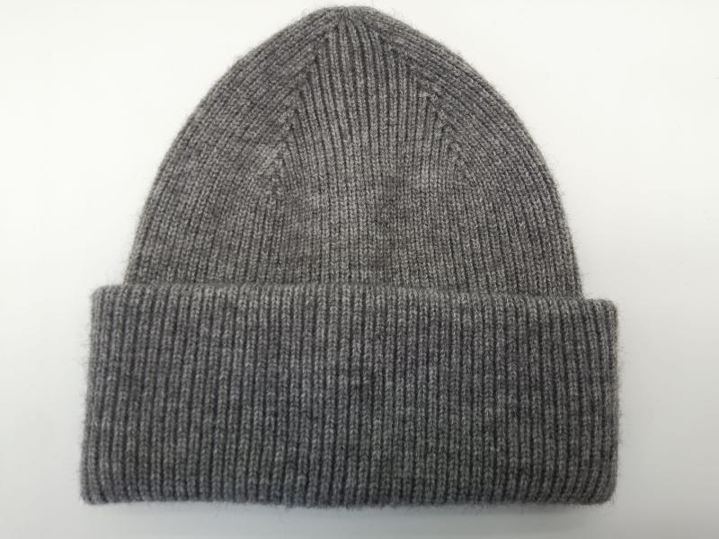 Heather grey ribbed knit beanie hat with wide folded cuff, laid flat on white background, soft wool blend