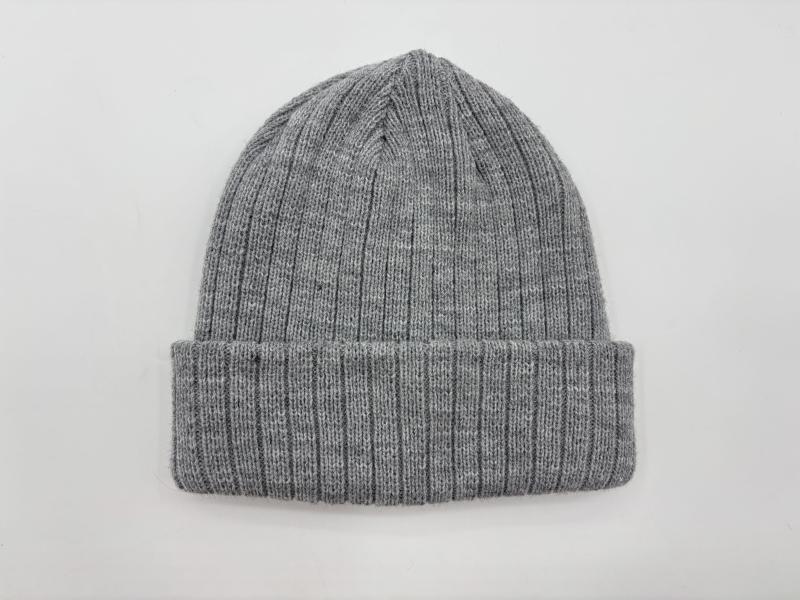 Heather grey ribbed knit cuffed beanie hat laid flat on white background, showing fine rib texture and folded brim