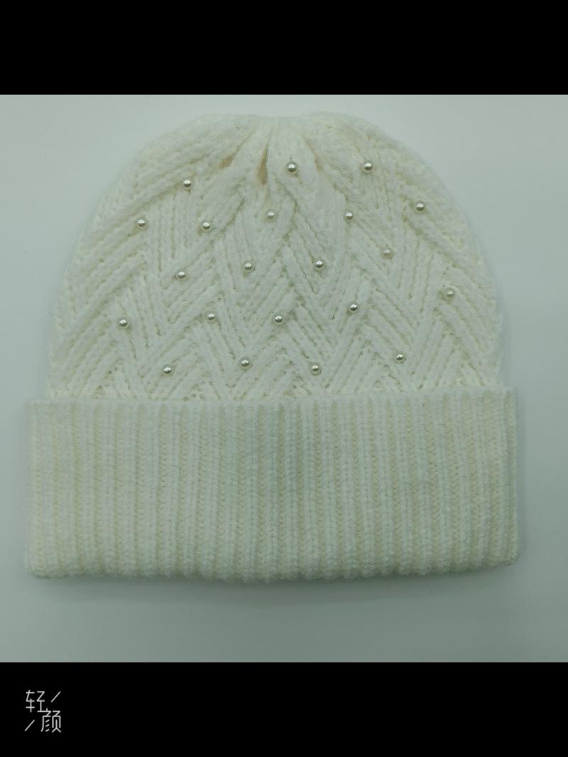 Cream white chunky knit beanie hat with chevron zigzag pattern and scattered pearl bead embellishments, folded cuff