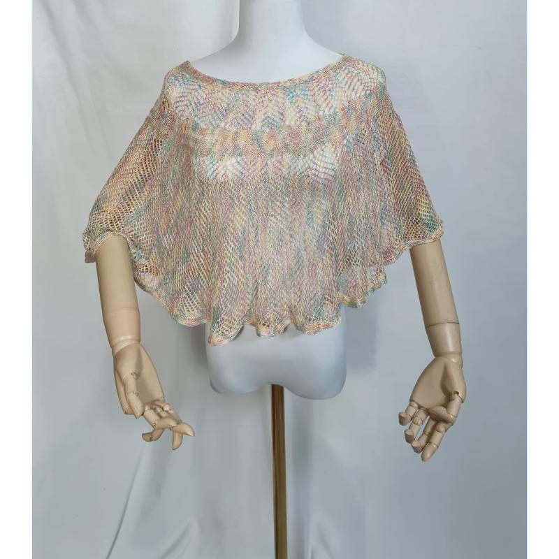 Pastel multicolor open-knit crochet crop poncho top displayed on a mannequin with wooden articulated arms
