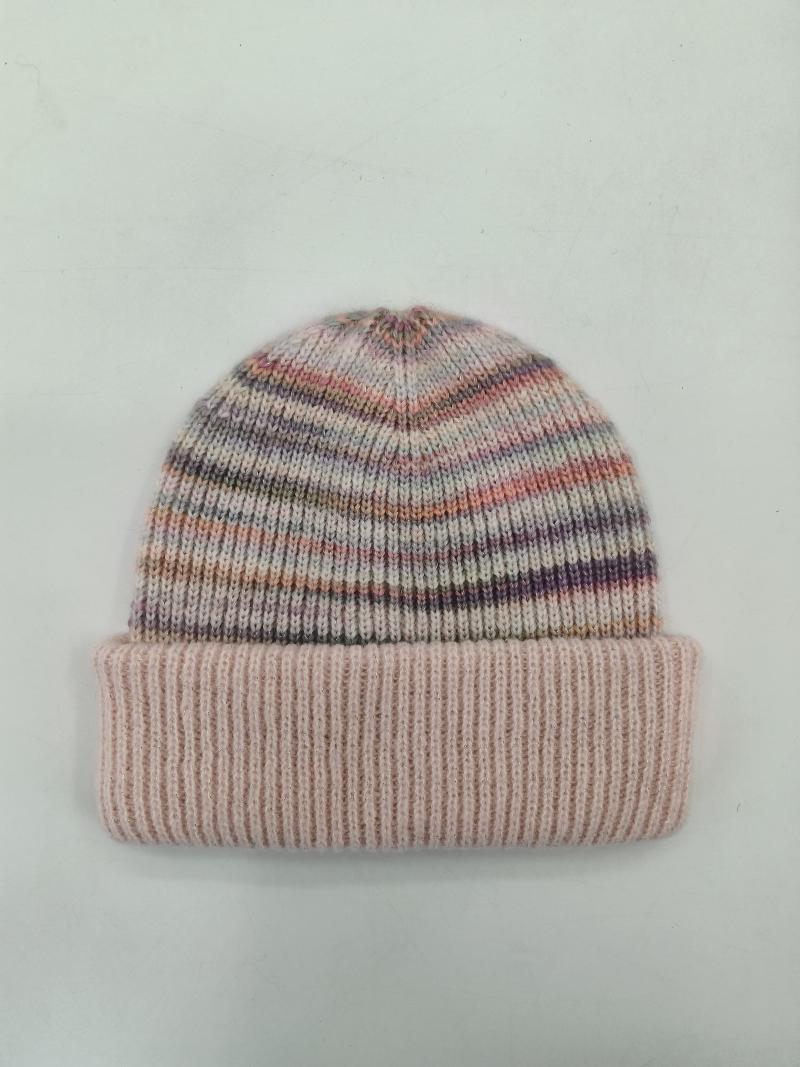 Soft knit beanie hat with multicolor pink purple grey stripes and wide ribbed cuff fold, laid flat on white background