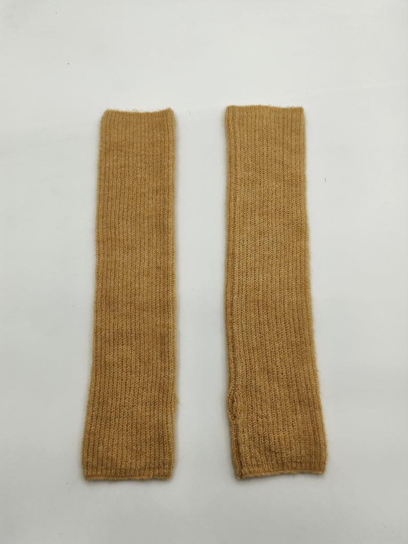 Pair of mustard yellow ribbed knit fingerless arm warmers laid flat on white background