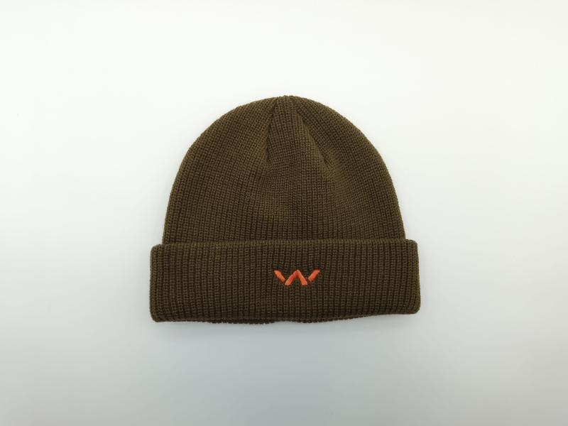 Olive green ribbed knit beanie hat with folded cuff and small orange embroidered logo, photographed flat on white background