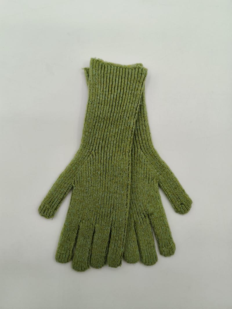 Flat lay of olive green ribbed knit gloves with extended wrist cuff on white background