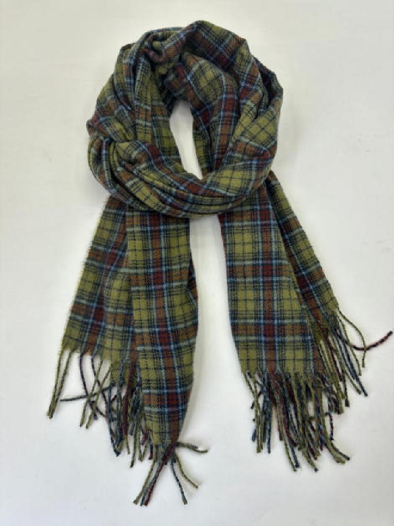 Olive green tartan plaid scarf with red, blue, and brown checks and knotted fringe ends, laid flat on white background