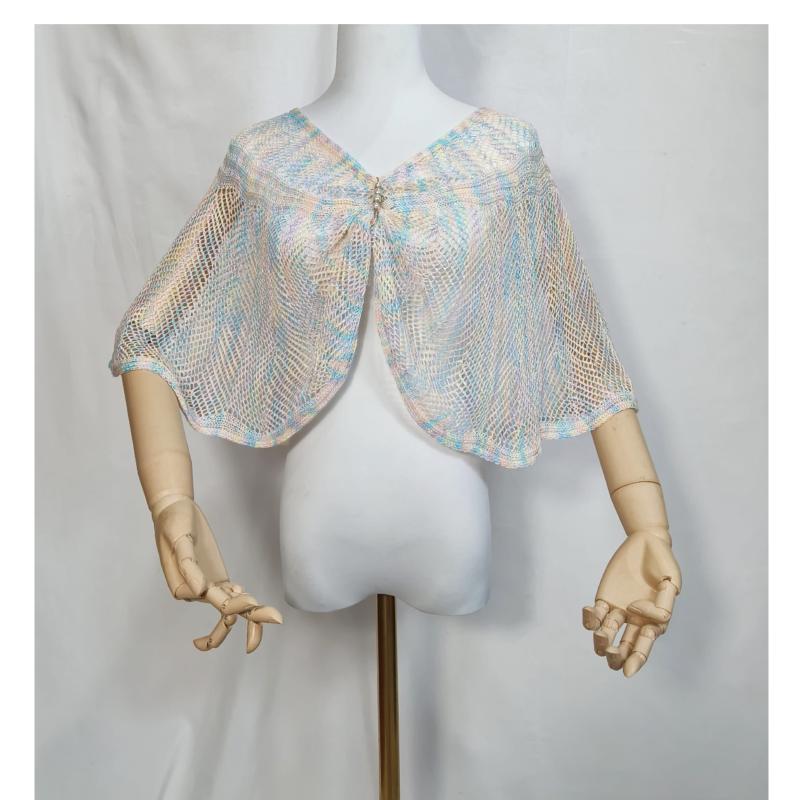 Pastel blue pink cream open-knit mesh capelet shawl with rhinestone brooch closure on white dress form mannequin